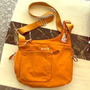 Awesome Tumi crossbody nylon and leather bag